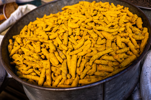 Moroccan turmeric displayed in the market store of a medina.