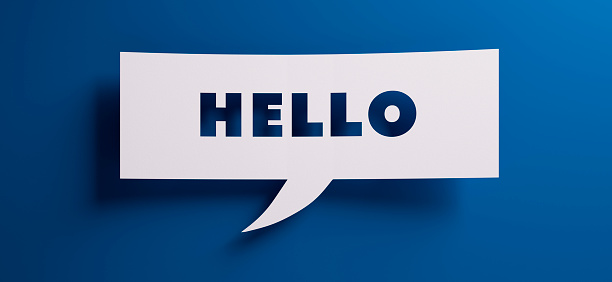 Speech bubble with the word hello in front of a blue colored wall - 3D illustration