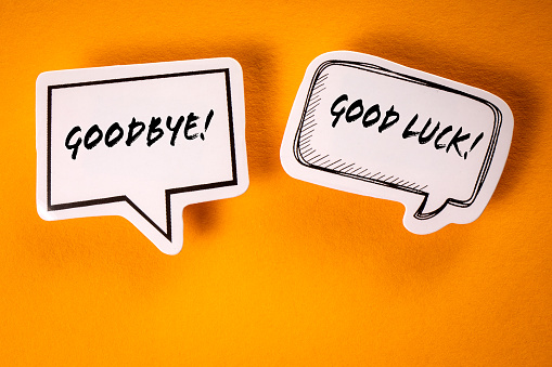 Goodbye and Good Luck. Text on speech bubbles. Yellow background.