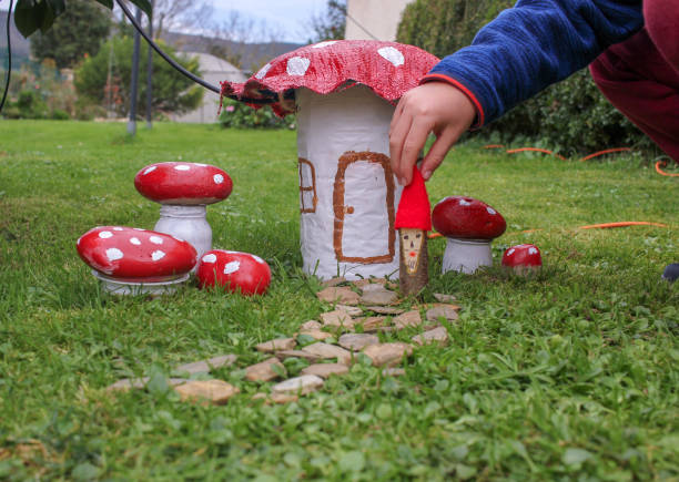 istock kid playing in the garden with ornaments 1451367831