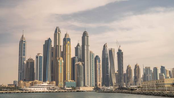 istock Clouds over the modern glass skyscrapers in Dubai 1451371681