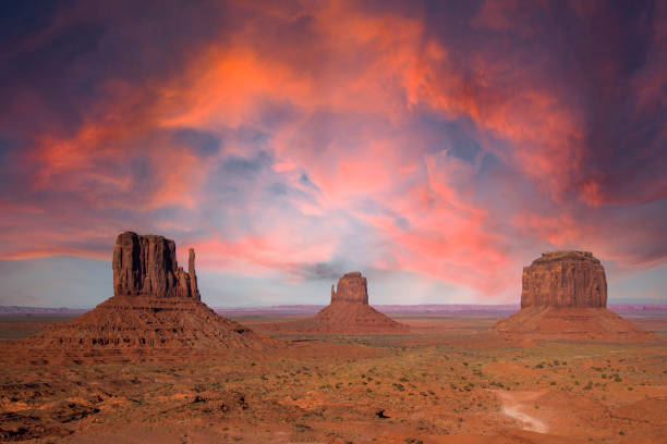 Monument Valley Evening view over the Mittens in Monument Valley. the mittens monument valley stock pictures, royalty-free photos & images