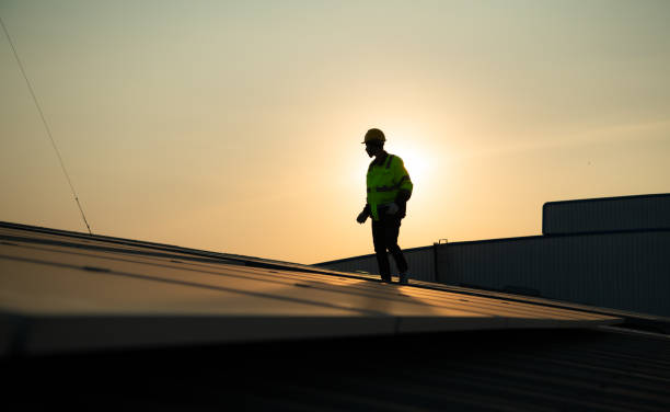 istock Technicians provide quarterly solar cell maintenance services on the factory roof 1451378033