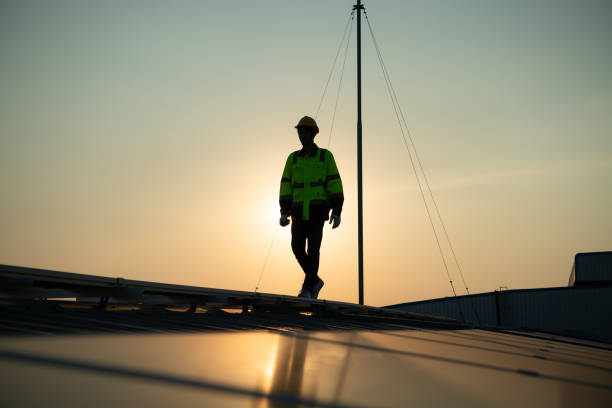istock Technicians provide quarterly solar cell maintenance services on the factory roof 1451378085