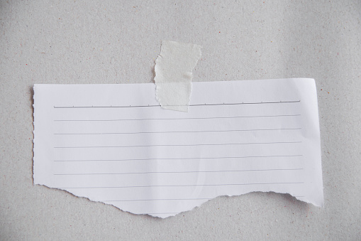 ripped  note paper for writing messages