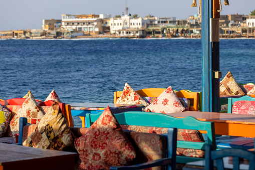 Dahab, Egypt - September 10, 2021: Restaurant on the shores of the Red Sea, on the main promenade in exotic small town on the Red Sea on the Sinai Peninsula