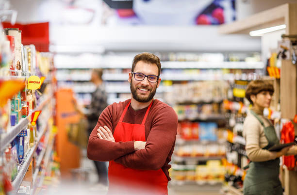 istock Retail clerk working in a supermarket 1451378440