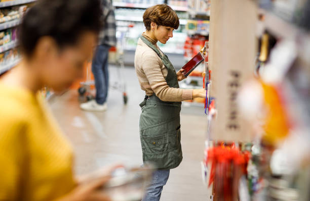 istock Retail clerk working in a supermarket 1451378547