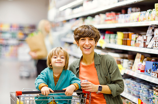 Mother and son shopping in a supermarket
