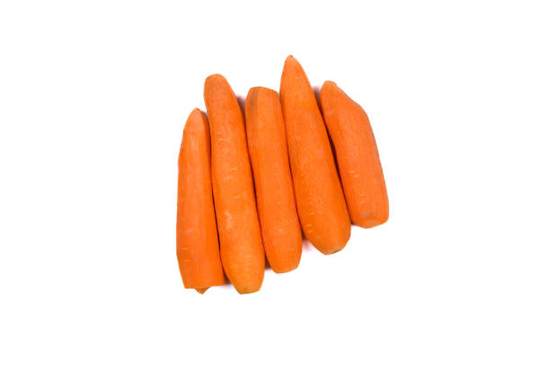 istock Peeled fresh carrots isolated on white background. Top view 1451380235
