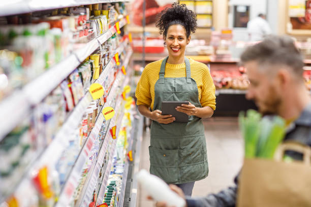 istock Retail clerk working in a supermarket 1451381233