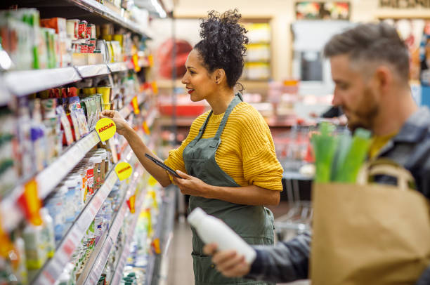 istock Retail clerk working in a supermarket 1451381234