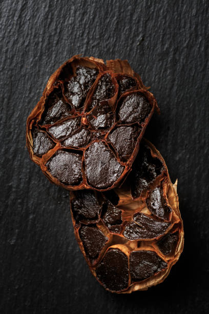 Organic Fermented Black Garlic on black table