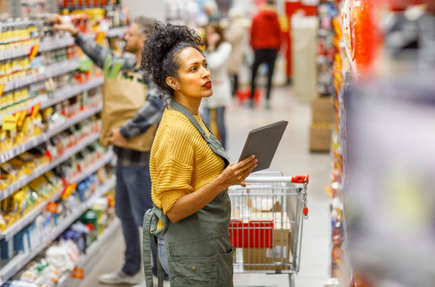 istock Retail clerk working in a supermarket 1451381702