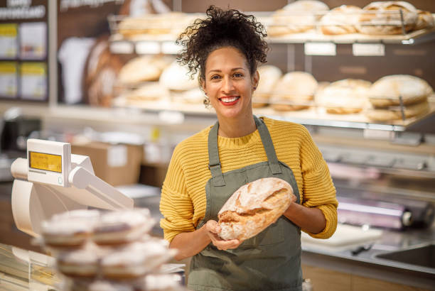 istock Saleswoman working in a bakery 1451381704