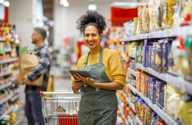 istock Retail clerk working in a supermarket 1451381705