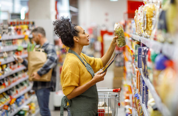 istock Retail clerk working in a supermarket 1451381706