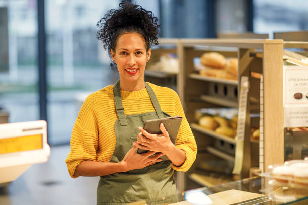 istock Retail clerk working in a supermarket 1451382413