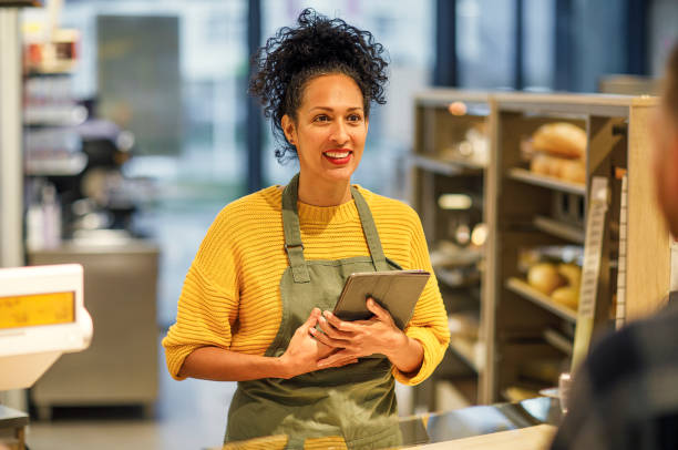 istock Retail clerk working in a supermarket 1451382670