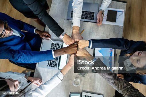 istock Fist bumb greeting and congratulations on the excellent teamwork, international business team colleagues 1451383514