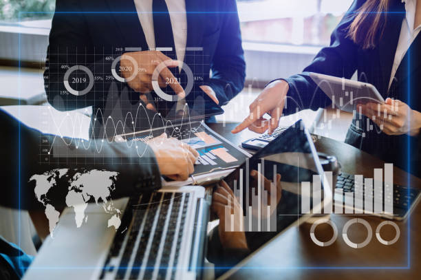 istock Three professional traides on technical price graph and indicator, red and green candlestick chart and stock trading computer at office 1451388404
