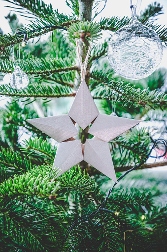 Beautiful Origami 5-pointed star hanging on Christmas tree
