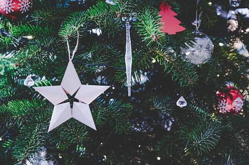 Beautiful Origami 5-pointed star hanging on Christmas tree