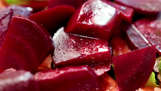 A plate of sweet red beetroot, sliced ​​as a garnish