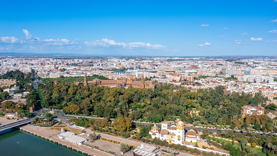 Aerial view of the Spanish city of Seville in the Andalusia region on the river Guadaquivir overlooking Plaza de Espana and Parque Maria.