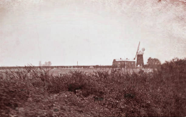 istock Windmill near Swavesey, Cambridgeshire with snow covered fields 1451399734
