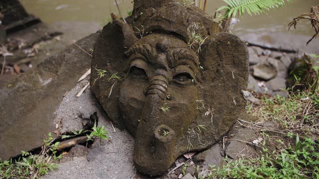 ancient sculpture of an elephant made of stone in Bali