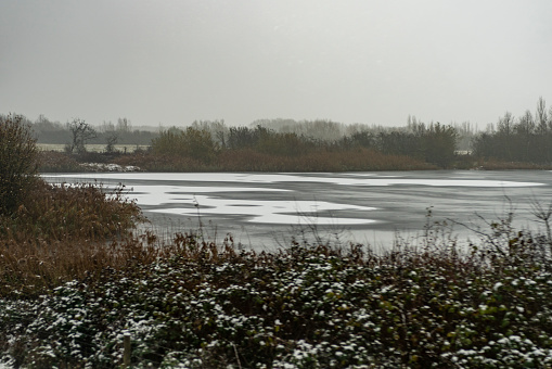 Nature reserve at Fen Drayton, Cambridgeshire with frozen lakes.