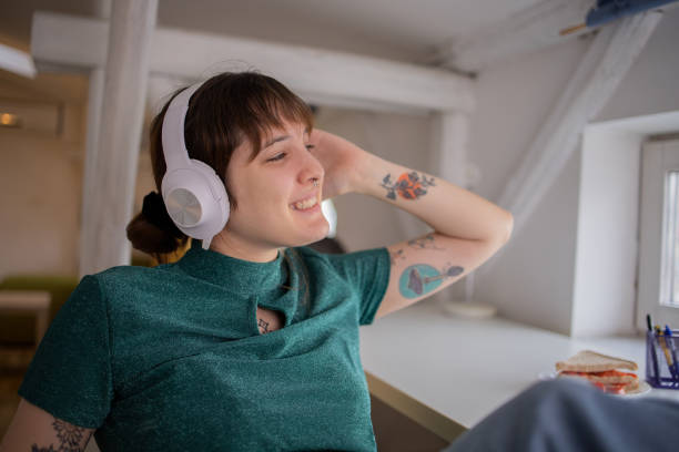 istock Young woman enjoying music 1451400617