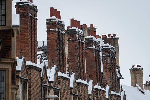Chimney stacks in the snow in Cambridge, Cambridgeshire.