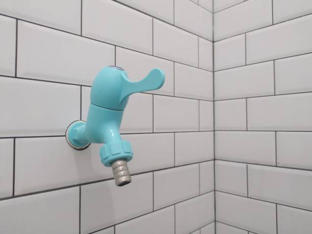 istock water faucet attached to the ceramic wall 1451403074