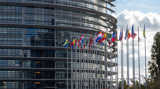 Strasbourg, France. October 8, 2022. European Parliament. Building facade with flags of different states. Sunny day