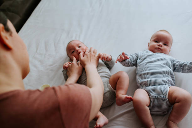 istock Mother applying baby cream on her babies 1451407152