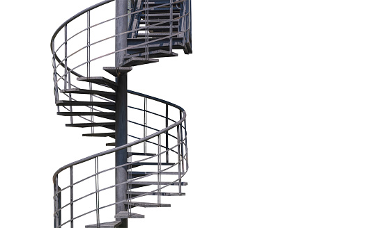 Confident and handsome businessman is walking upstairs on spiral stairs in office building hall corridor. Photo taken from above.