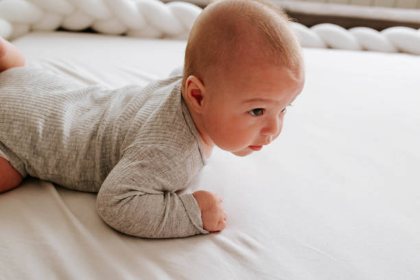 istock Cute baby lying on the bed 1451407187