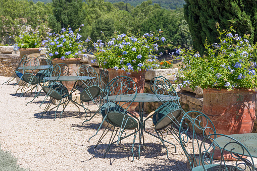 Scenic view of outdoor terrace tables in a row from a hot summer in Provence