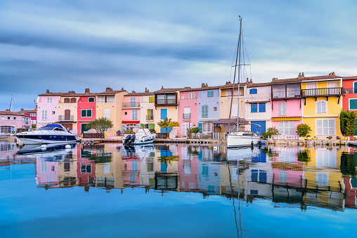 Scenic view of Port Grimaud village in south of France in autumn pastel colors against dramatic sky