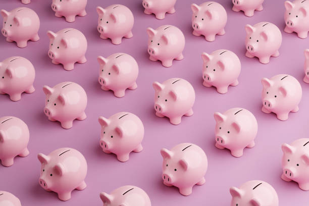 array of pink piggy banks on pink background. illustration of the concept of personal savings and financial investment - mealheiro imagens e fotografias de stock