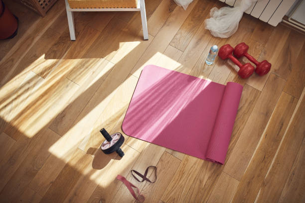 istock Training inside the living room, exercising at home. 1451418552