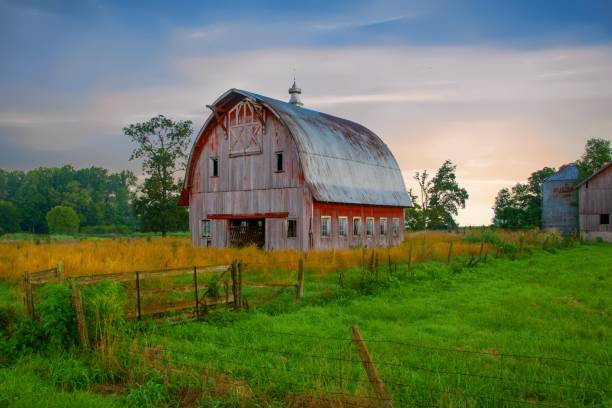 istock Old weathered Red Barn at sunrise-Howard County, Indiana 1451424397
