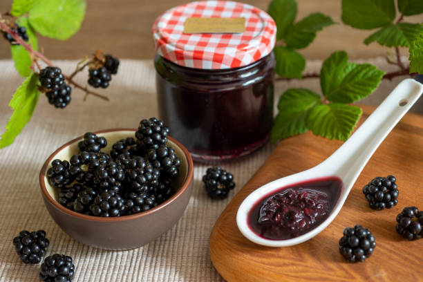istock Blackberries in bowl with blackberry jam or jelly 1451425217