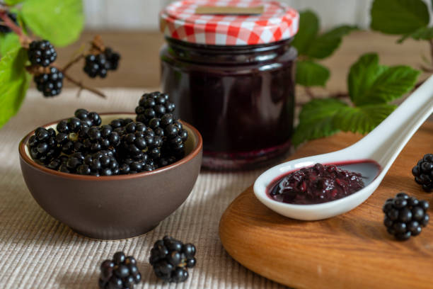 istock Blackberries in bowl with blackberry jam or jelly 1451426539