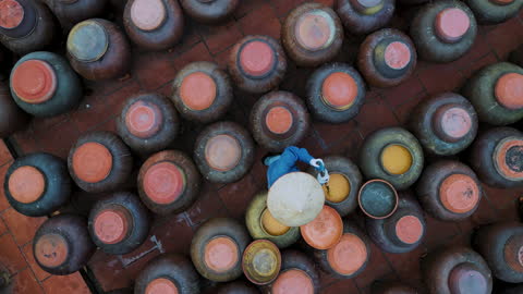 Top view of Jars of processing soybean jam made by traditional outdoor way under natural sunlight