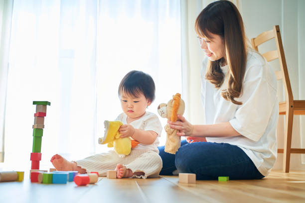 istock Parent and child playing with puppets 1451427290