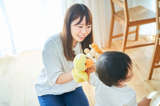 istock Parent and child playing with puppets 1451427370