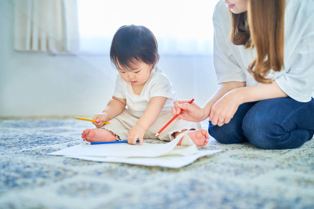 istock Parent and child playing with drawing 1451427662